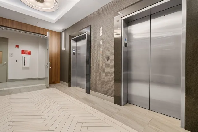 a bathroom with a shower and a sink