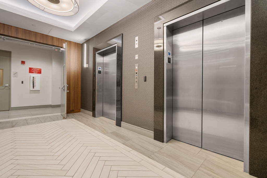 121-127 Portland Street, Unit 202 Boston, MA 02114 - Photo 22 of 25 a bathroom with a shower and a sink