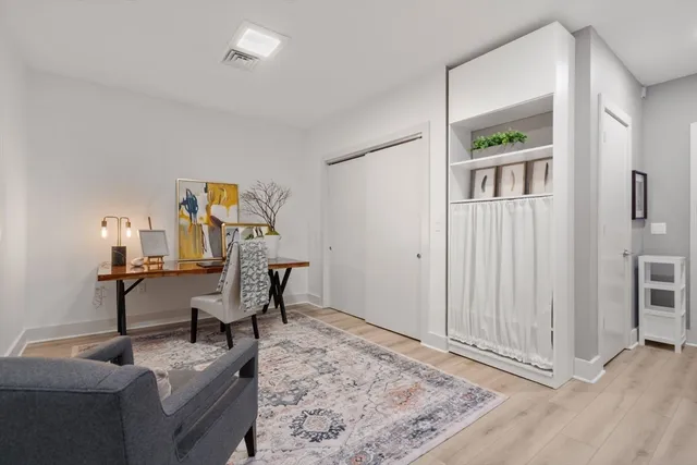 a view of a livingroom with furniture and wooden floor