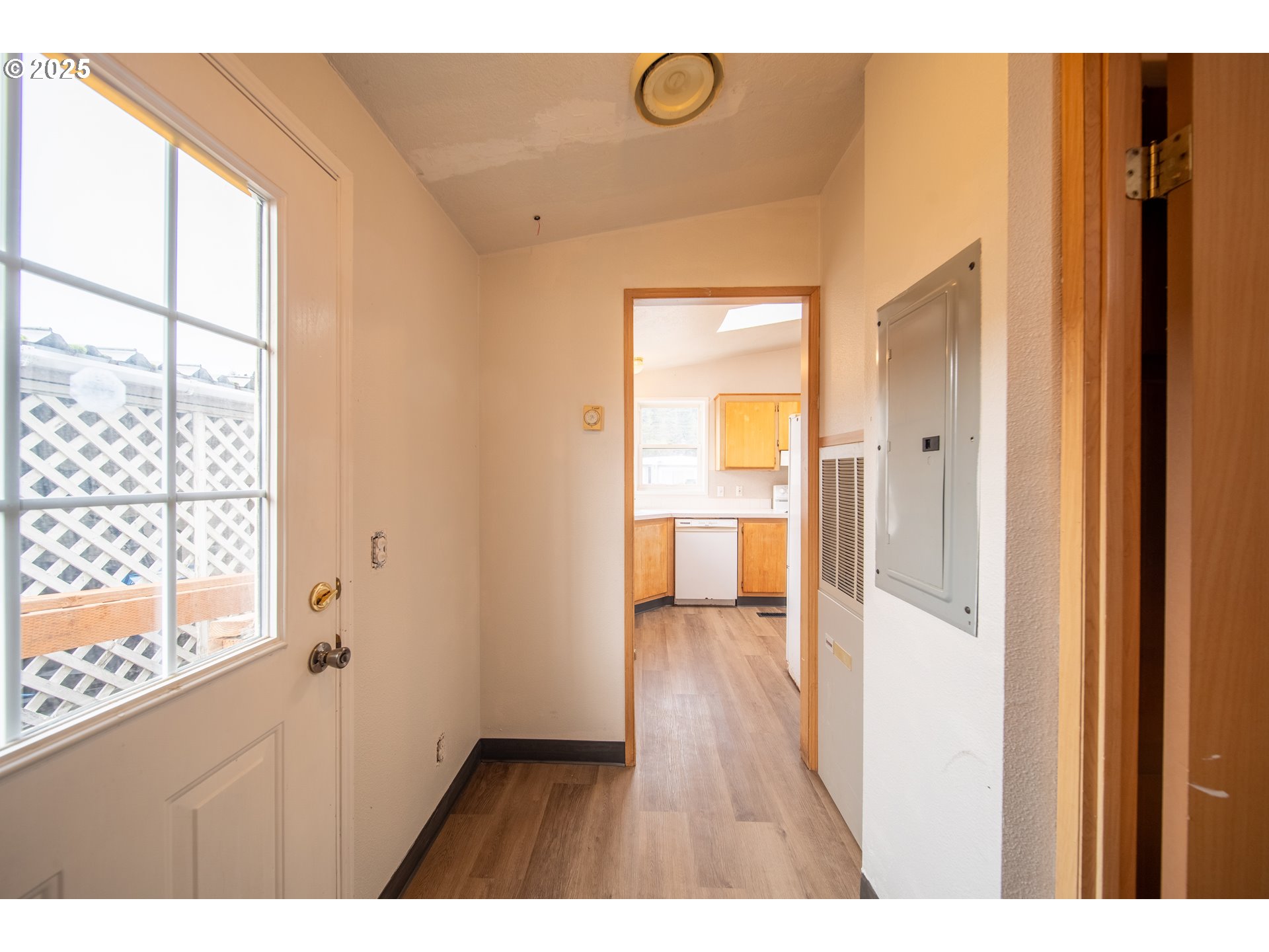 1413 Hawthorne Avenue Reedsport, OR 97467 - Photo 16 of 32 a view of hallway with wooden floor