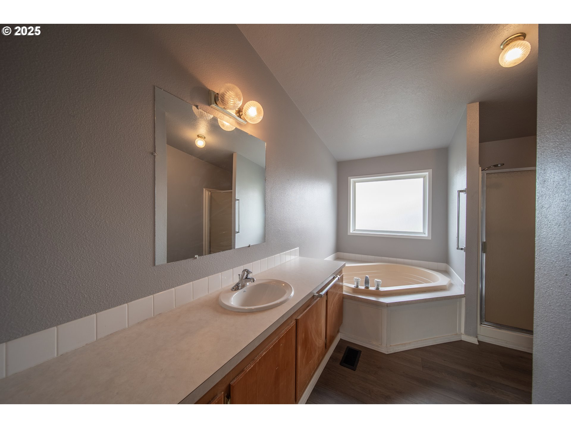 1413 Hawthorne Avenue Reedsport, OR 97467 - Photo 22 of 32 a bathroom with a sink and a mirror