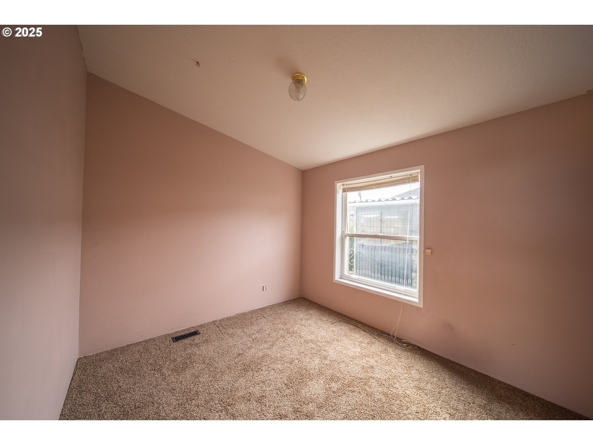 1413 Hawthorne Avenue Reedsport, OR 97467 - Photo 25 of 32 a view of an empty room with a window