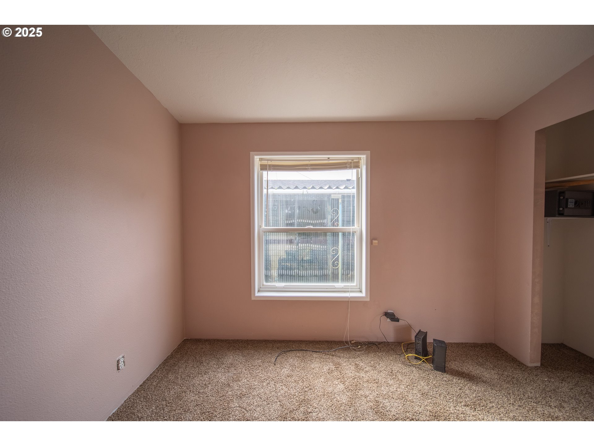 1413 Hawthorne Avenue Reedsport, OR 97467 - Photo 26 of 32 a view of an empty room with a window