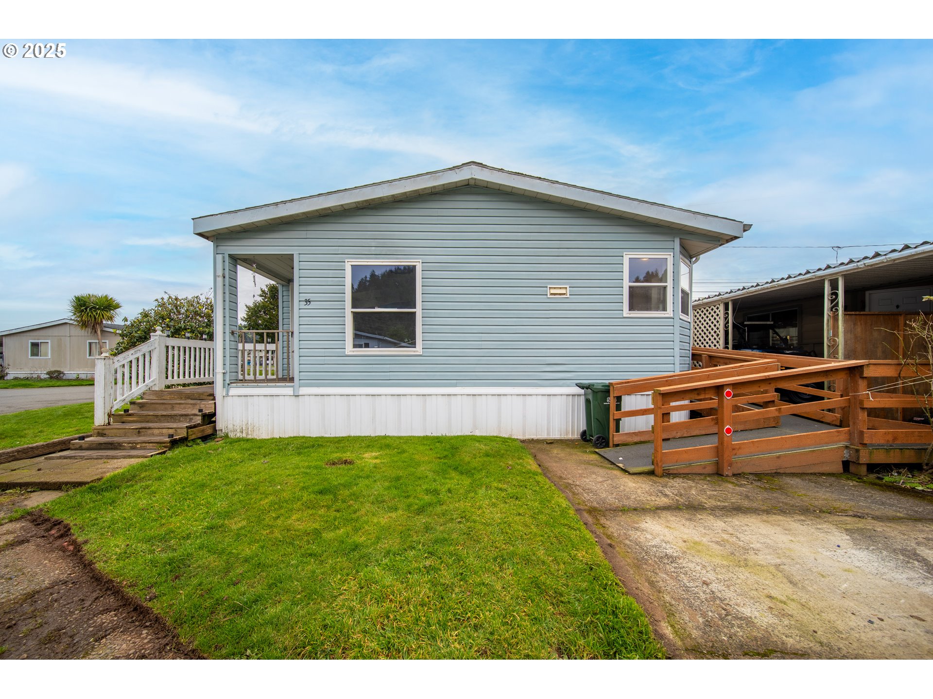 1413 Hawthorne Avenue Reedsport, OR 97467 - Photo 4 of 32 a backyard of a house with barbeque oven and outdoor seating