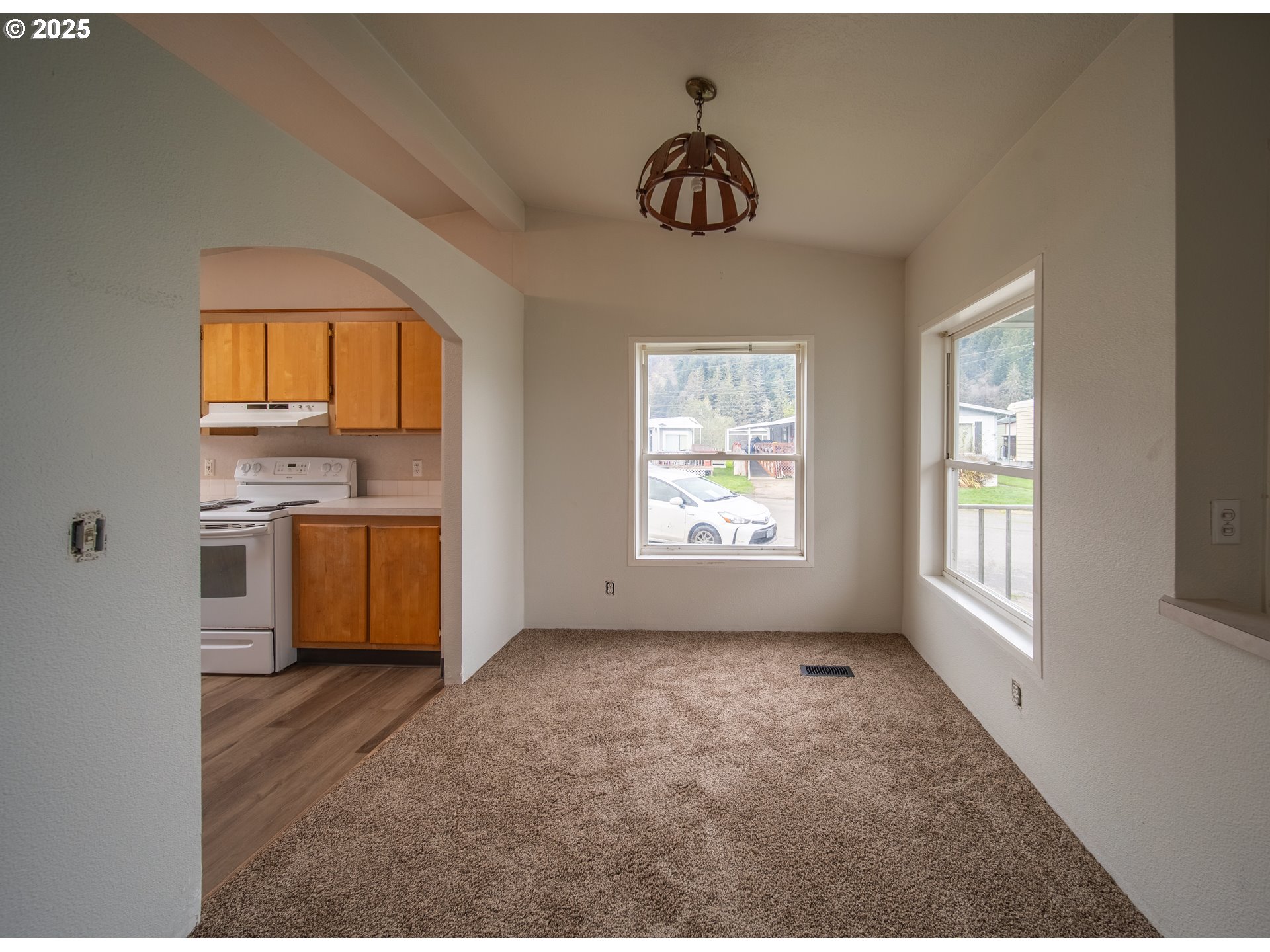 1413 Hawthorne Avenue Reedsport, OR 97467 - Photo 8 of 32 a view of a kitchen with a sink dishwasher and a window