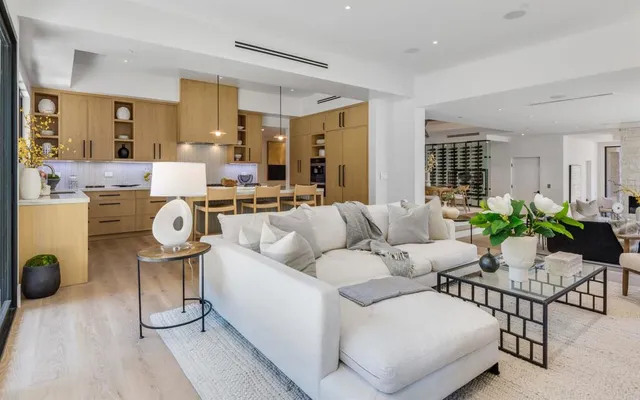 a living room with furniture white walls and white walls