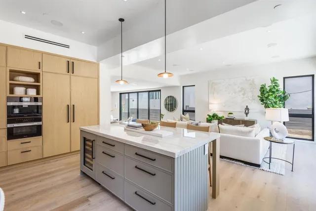 a bed room with furniture and a wooden floor
