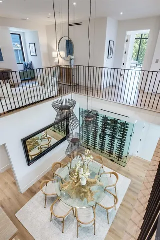 a bedroom with a large bed and a large window