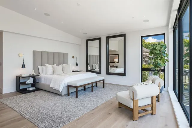 a bathroom with a tub shower and sink