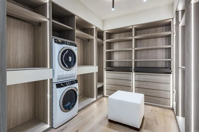 a bedroom with a large bed and a large window