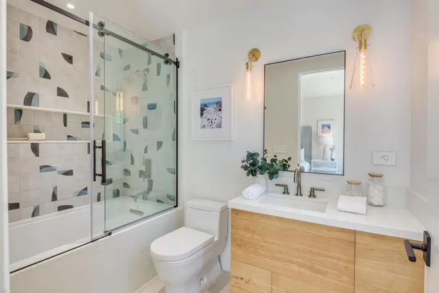 a bathroom with a double vanity sink and a mirror