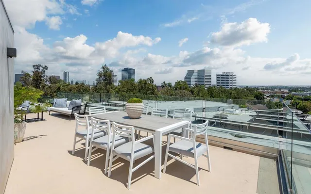 a view of roof deck with patio