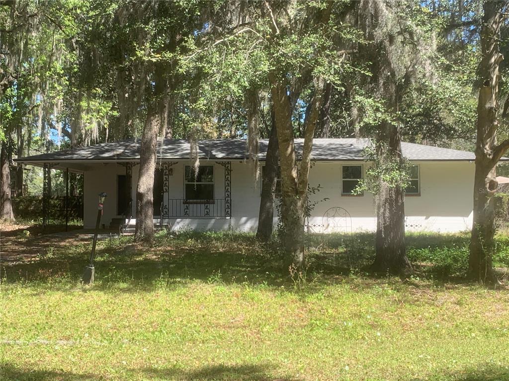 3055 Oak Road Orange Park, FL 32065 - Photo 1 of 13 a front view of a house with a yard