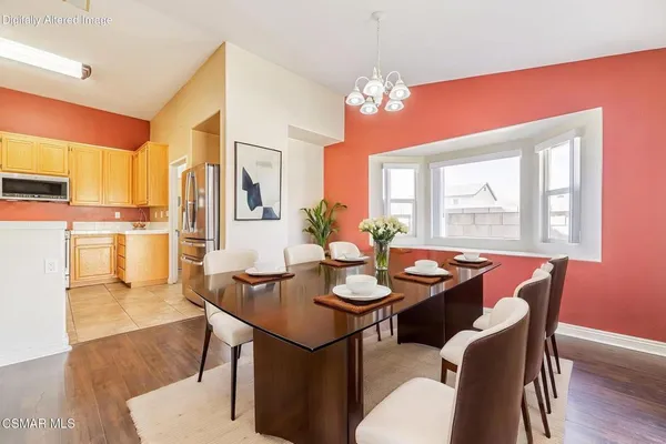 a bedroom with a bed and a tv