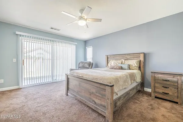 a bedroom with a bed and a tv