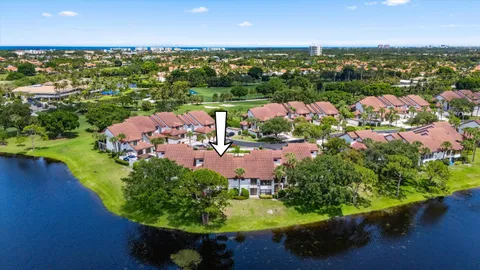 an aerial view of lake residential house with swimming pool and outdoor space