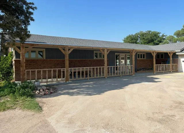 front view of a house with a yard