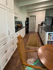 a view of living room with furniture and flat screen tv
