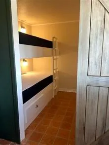 a bed room with a bed and a lamp