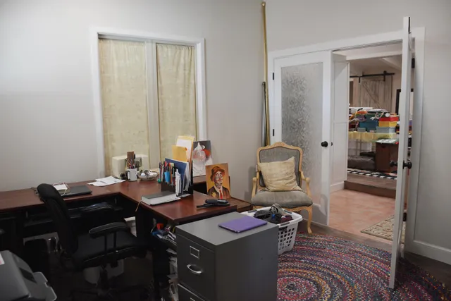 a utility room with cabinets washer and dryer