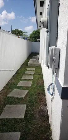 a view of a backyard with sitting area