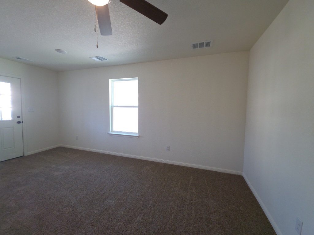 2002 West 2nd Street, Unit 1202 Taylor, TX 76574 - Photo 6 of 15 Living room with door to balcony