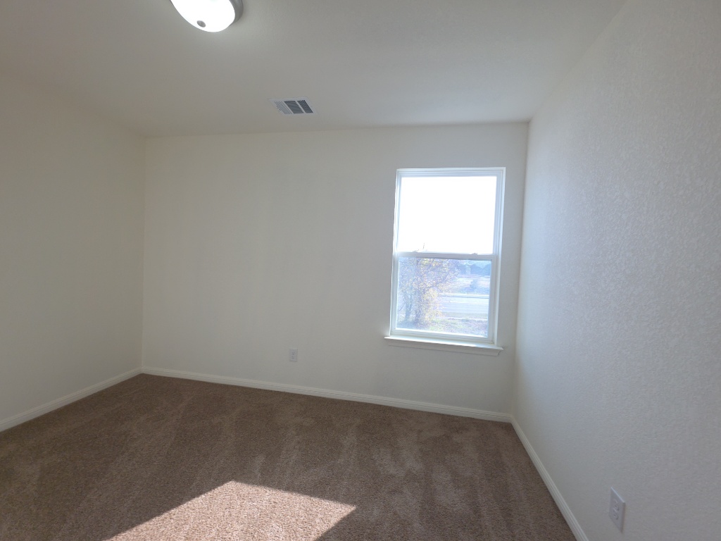 2002 West 2nd Street, Unit 1202 Taylor, TX 76574 - Photo 9 of 15 Primary bedroom with natural light