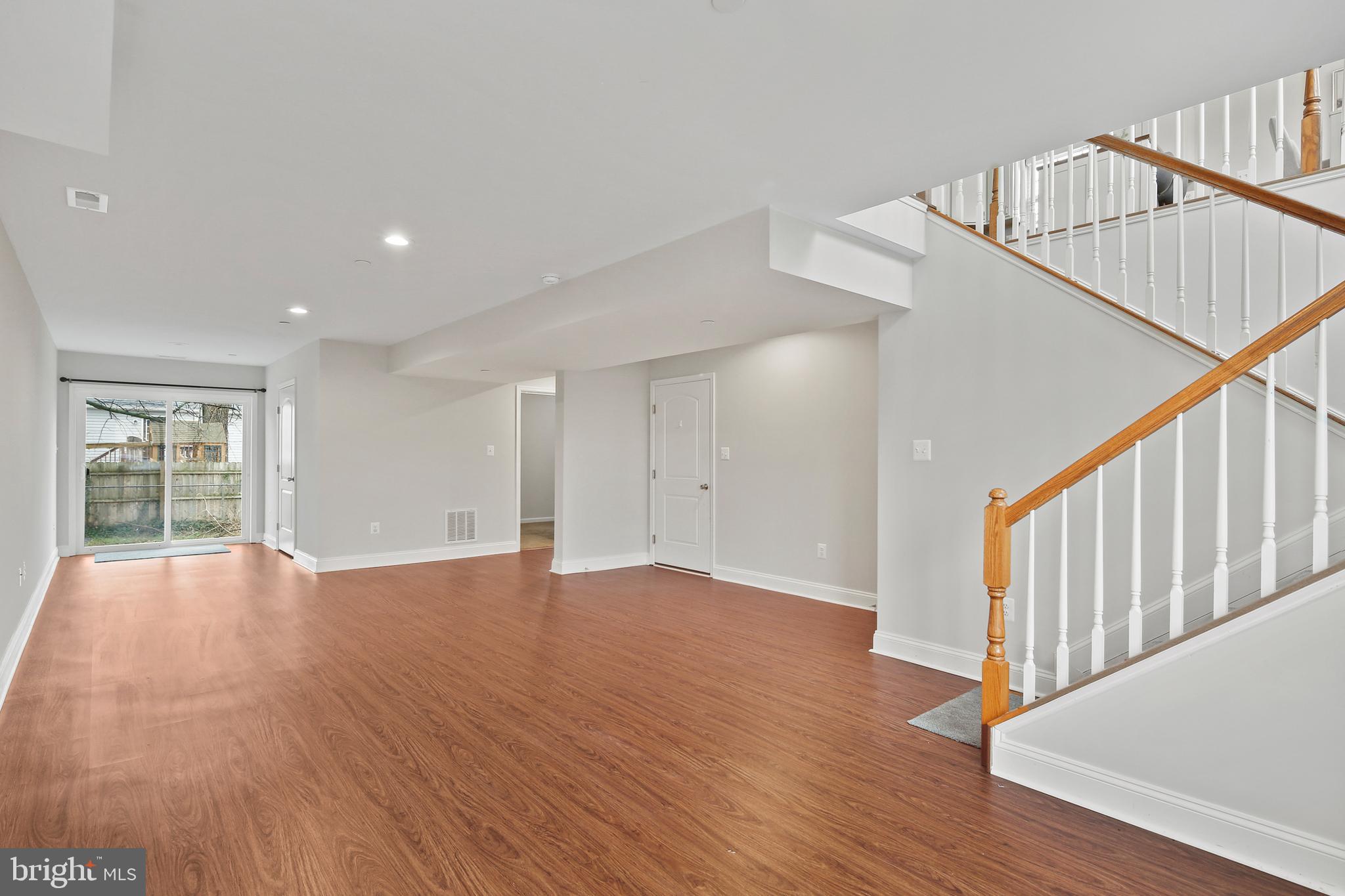 617 Cedar Hill Road Baltimore, MD 21225 - Photo 24 of 38 Lower Level Family Room w/ LVP Floor