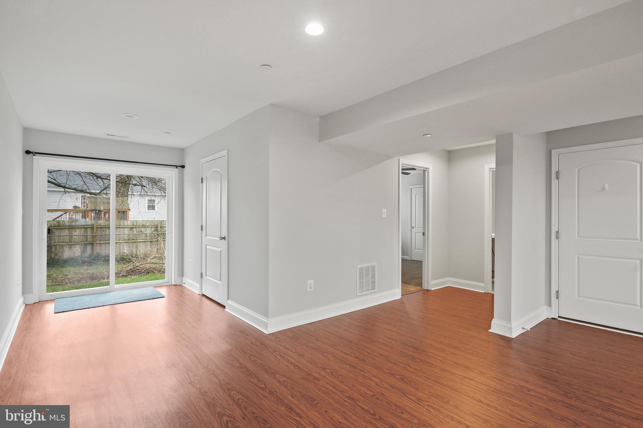 617 Cedar Hill Road Baltimore, MD 21225 - Photo 25 of 38 Lower Level Family Room w/ Access to Backyard