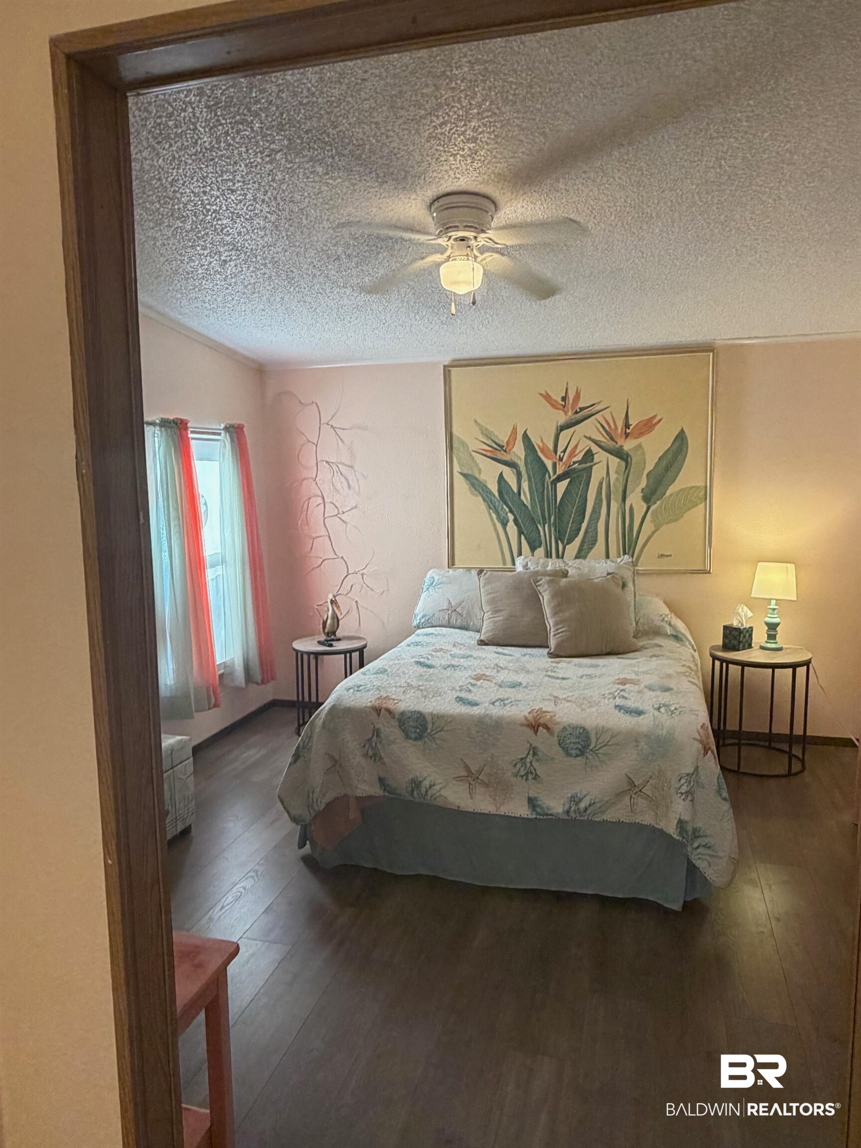 1127 Ridgewood Drive Lillian, AL 36549 - Photo 7 of 32 Bedroom featuring dark wood finished floors, ceiling fan, and a textured ceiling