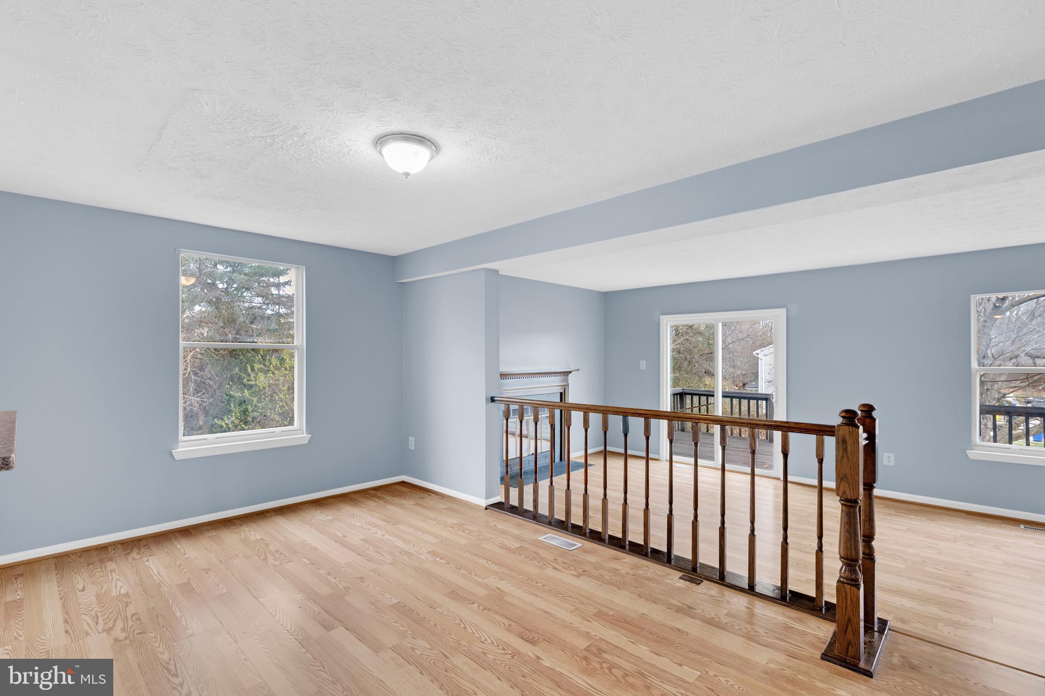 7600 Mandan Road Greenbelt, MD 20770 - Photo 12 of 42 a view of an empty room with wooden floor and a window