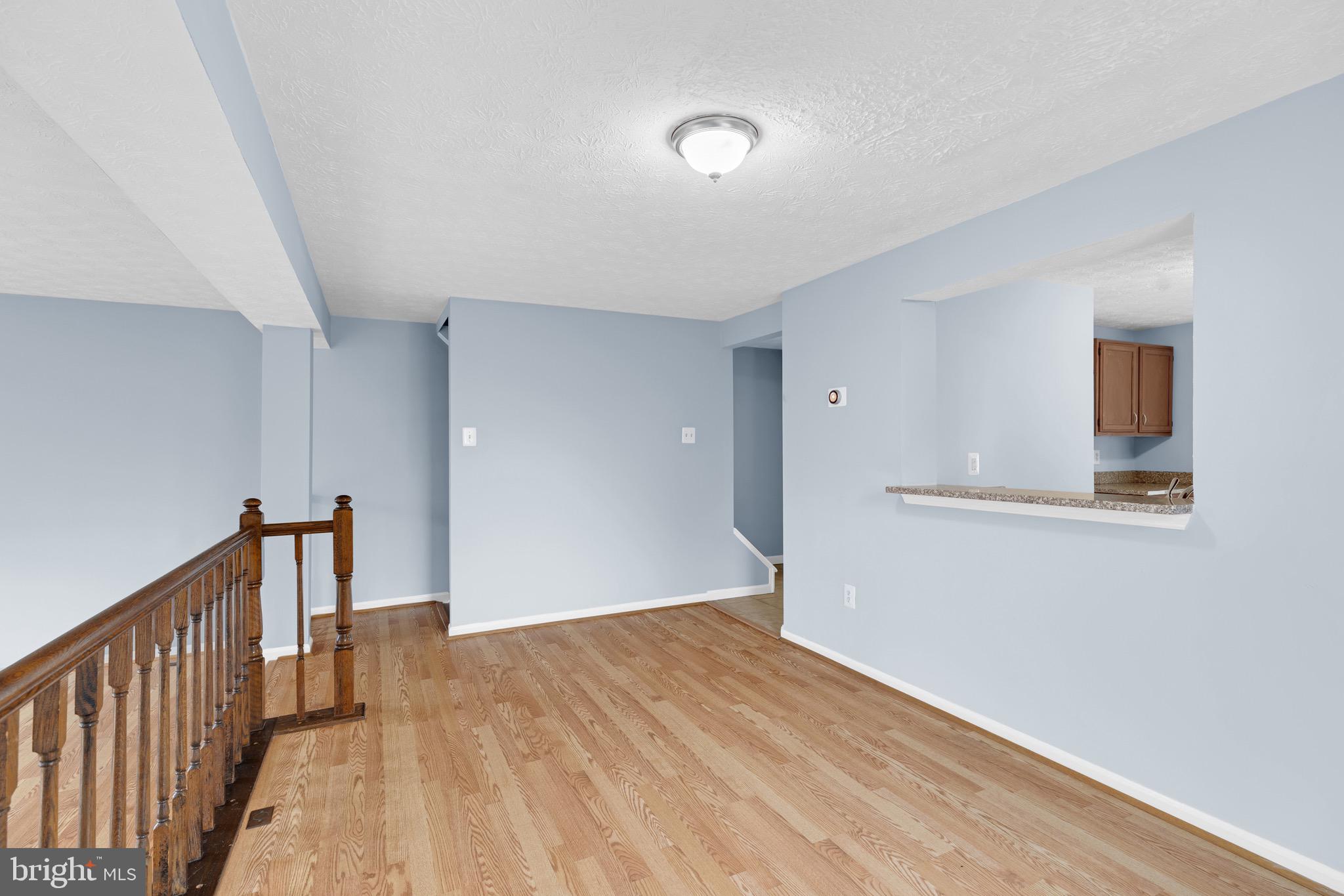 7600 Mandan Road Greenbelt, MD 20770 - Photo 13 of 42 a view of an empty room with wooden floor