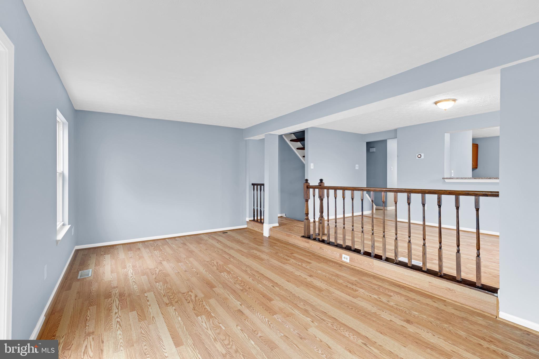 7600 Mandan Road Greenbelt, MD 20770 - Photo 14 of 42 a view of an empty room with wooden floor