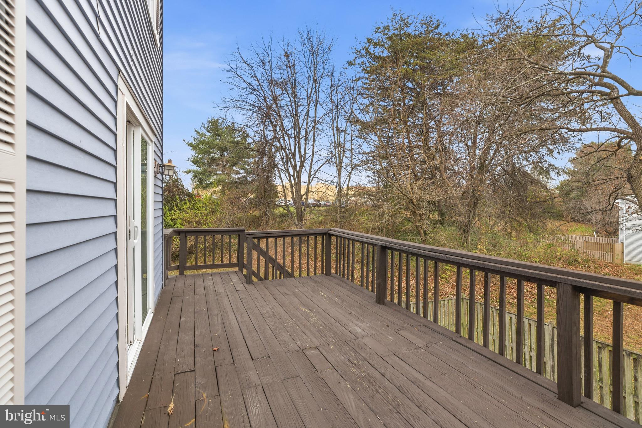 7600 Mandan Road Greenbelt, MD 20770 - Photo 16 of 42 a balcony with wooden floor and fence