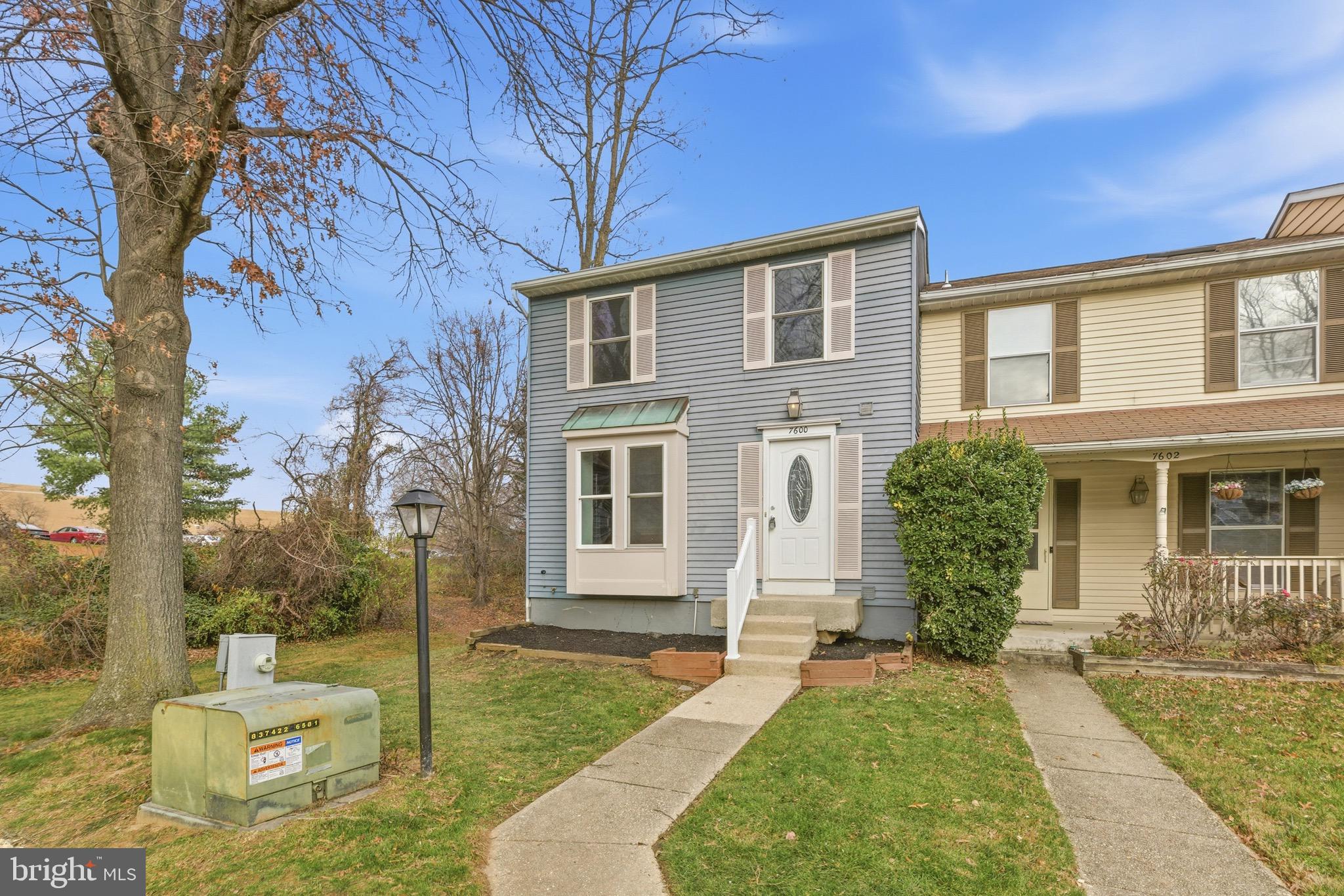 7600 Mandan Road Greenbelt, MD 20770 - Photo 2 of 42 a front view of a house with garden