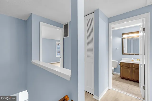 a view of a bathroom from the hallway