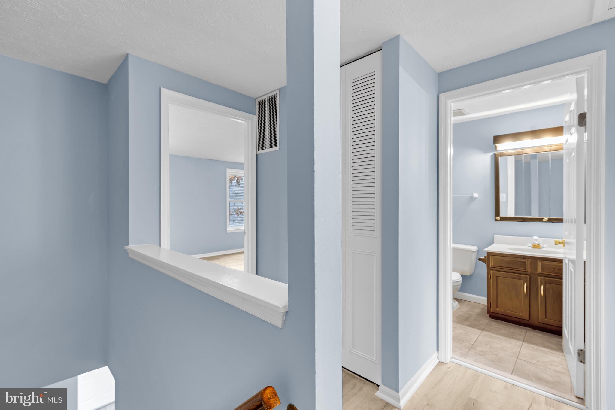 7600 Mandan Road Greenbelt, MD 20770 - Photo 21 of 42 a view of a bathroom from the hallway