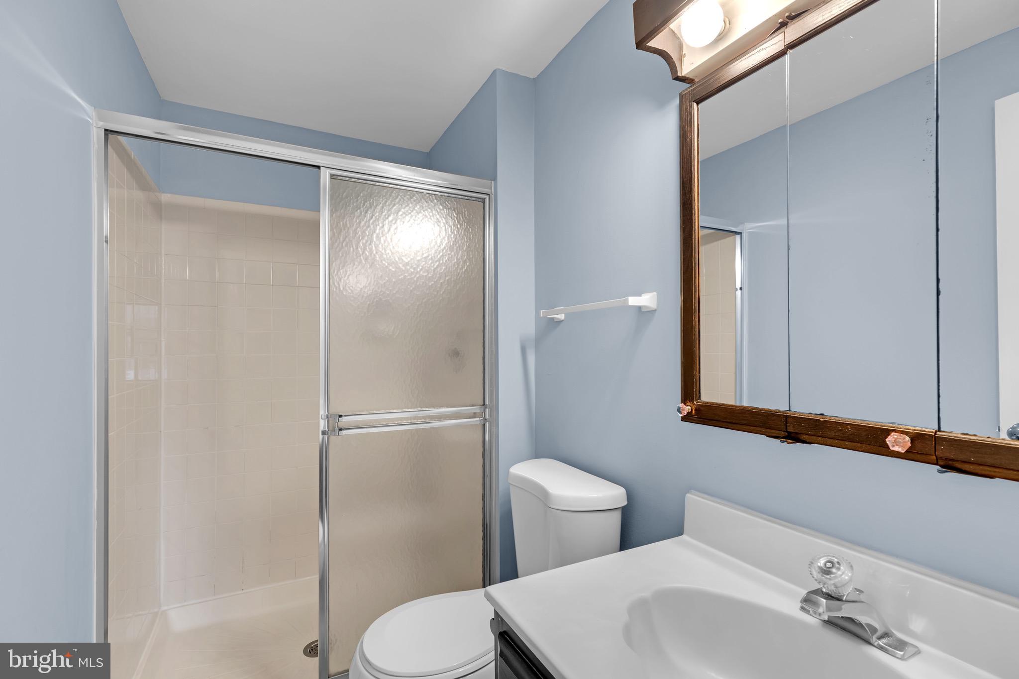 7600 Mandan Road Greenbelt, MD 20770 - Photo 25 of 42 a bathroom with a toilet and a sink