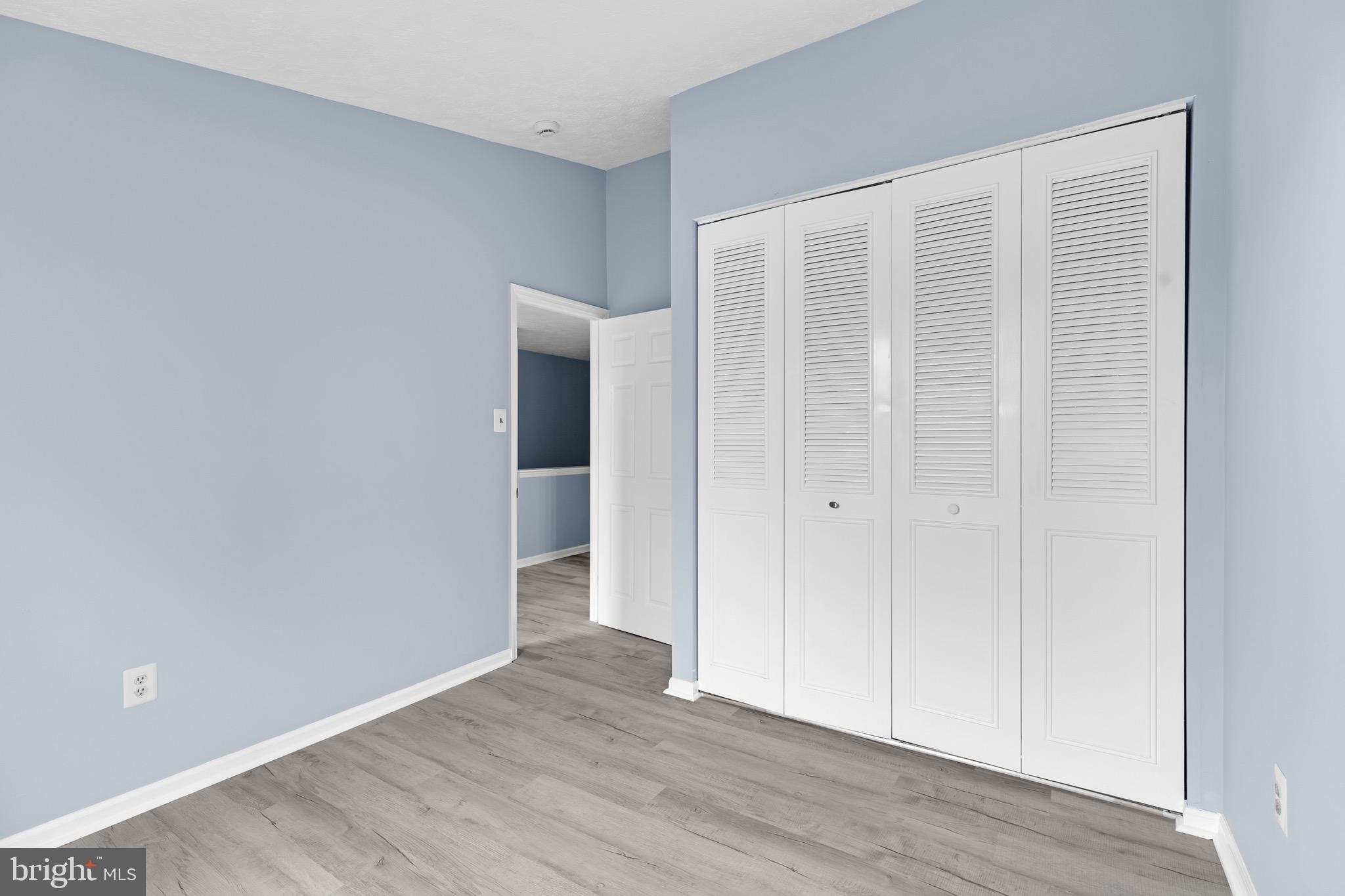 7600 Mandan Road Greenbelt, MD 20770 - Photo 29 of 42 a view of an empty room with wooden floor