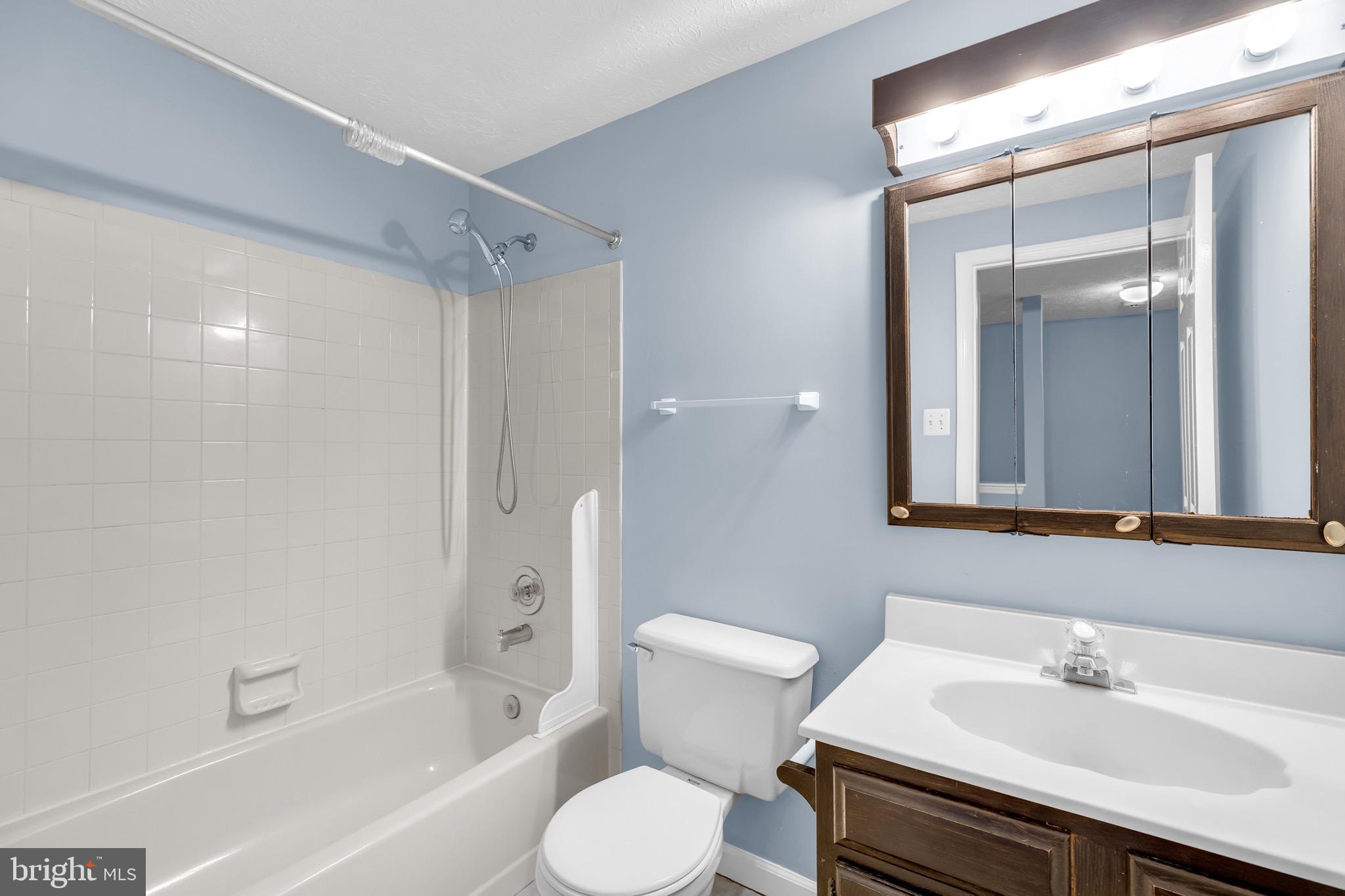 7600 Mandan Road Greenbelt, MD 20770 - Photo 30 of 42 a bathroom with a sink toilet and shower