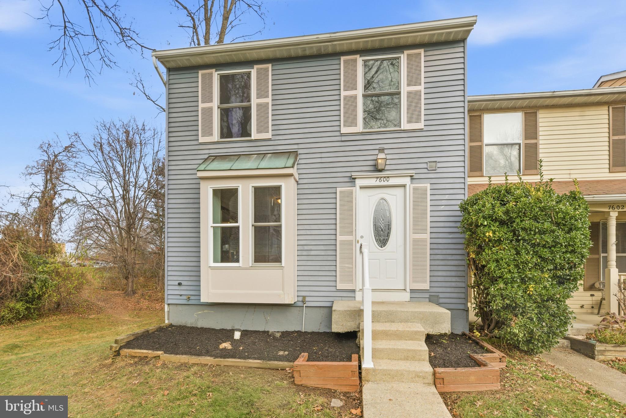 7600 Mandan Road Greenbelt, MD 20770 - Photo 3 of 42 a front view of a house with a yard