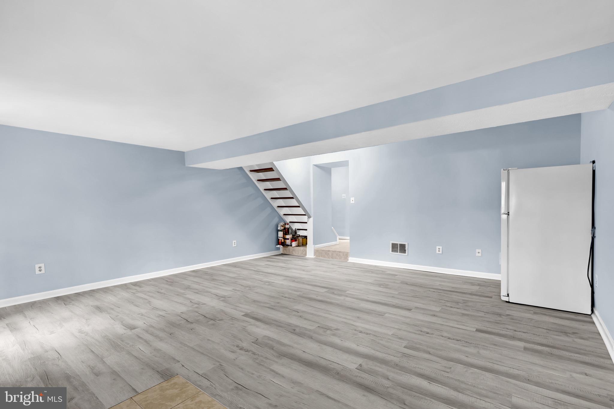 7600 Mandan Road Greenbelt, MD 20770 - Photo 33 of 42 a view of an empty room with wooden floor