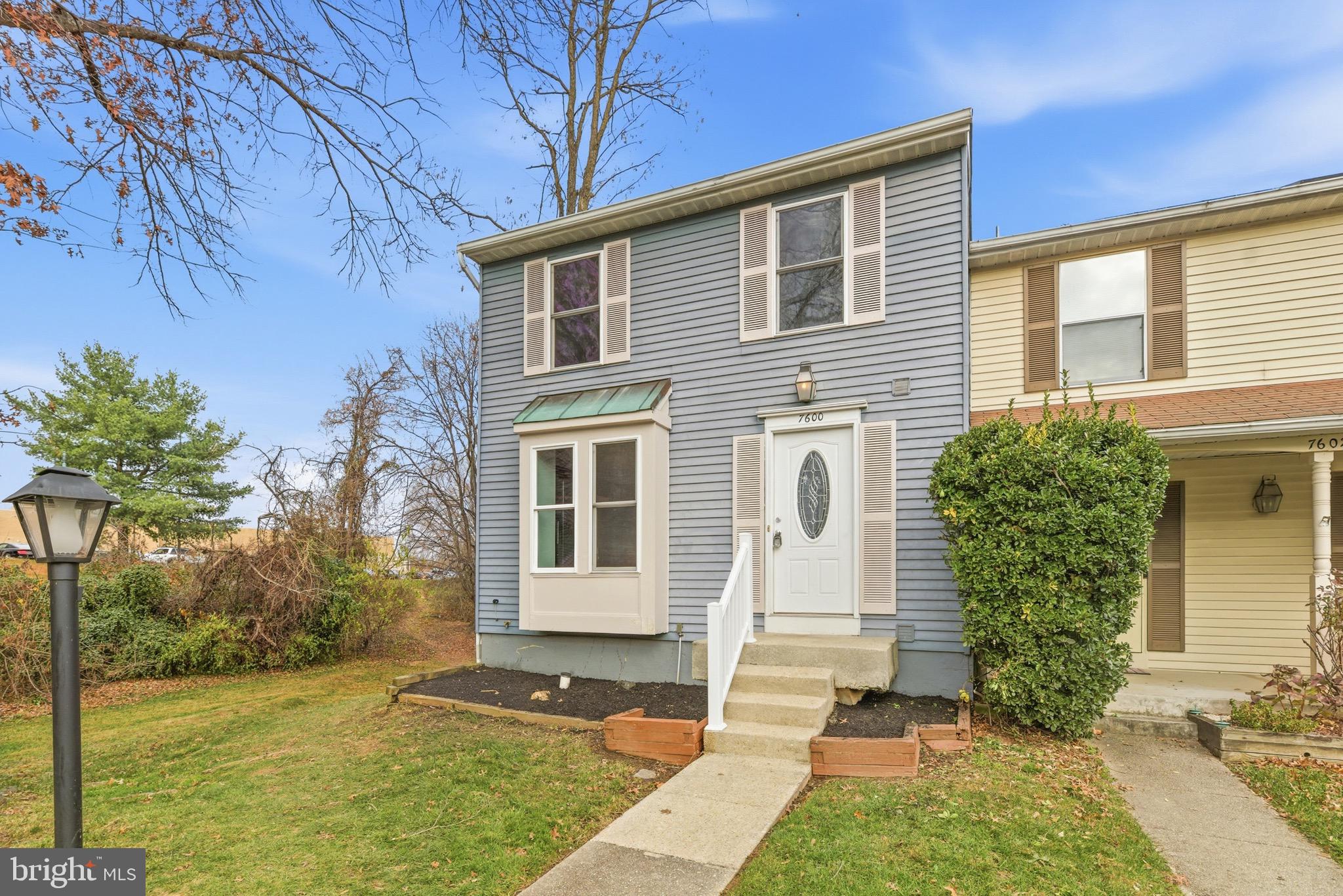 7600 Mandan Road Greenbelt, MD 20770 - Photo 4 of 42 a front view of a house with garden