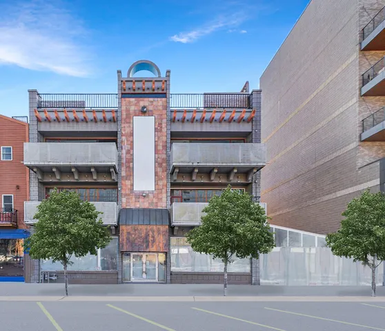a view of a building with a street
