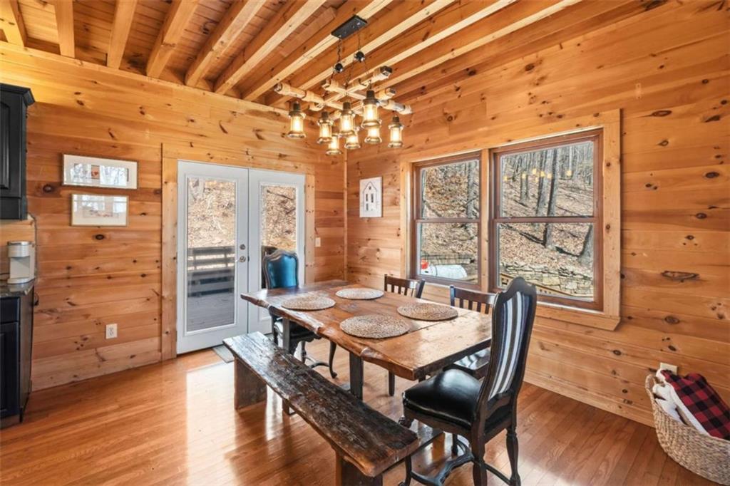 71 Cutthroat Ridge Road Jasper, GA 30143 - Photo 16 of 44 a dining room with furniture window wooden floor