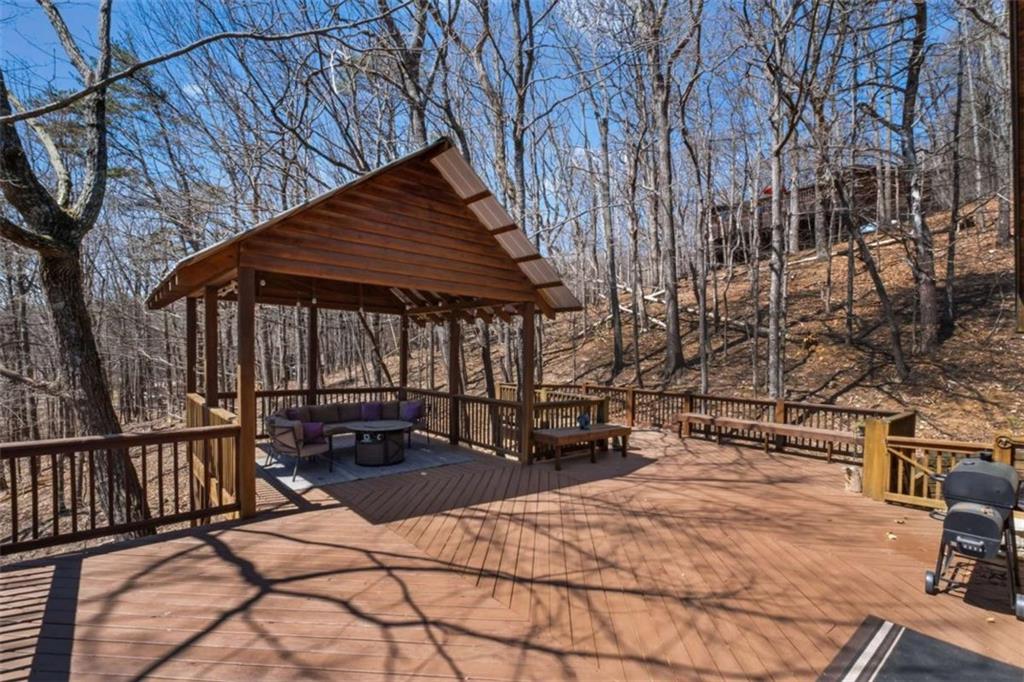 71 Cutthroat Ridge Road Jasper, GA 30143 - Photo 38 of 44 a patio with table and chairs and potted plants