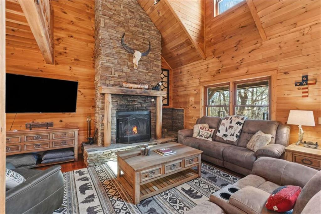 71 Cutthroat Ridge Road Jasper, GA 30143 - Photo 7 of 44 a living room with furniture a flat screen tv and a fireplace