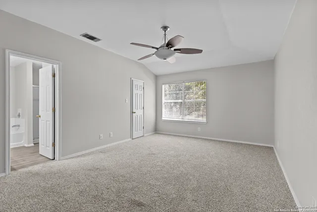 a view of an empty room with a window