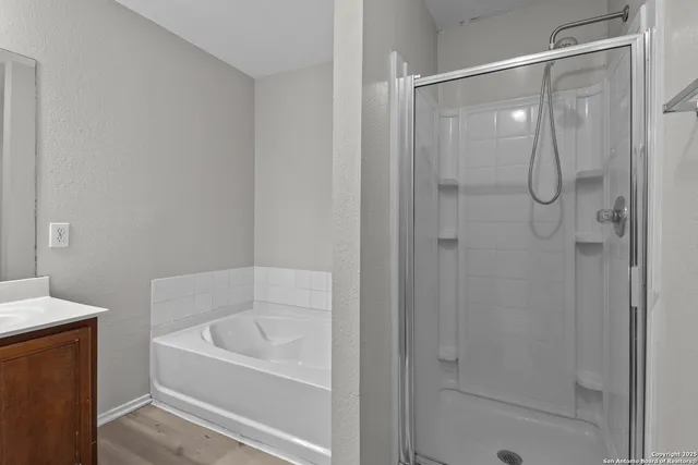 a bathroom with a bathtub and a shower