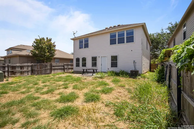 a front view of house with yard and seating area